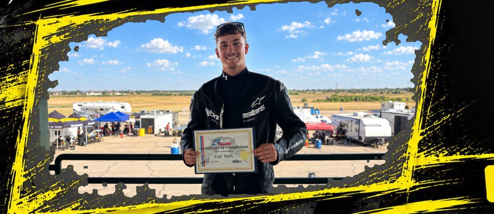 Kyle Nash holding his Certificate of Completion